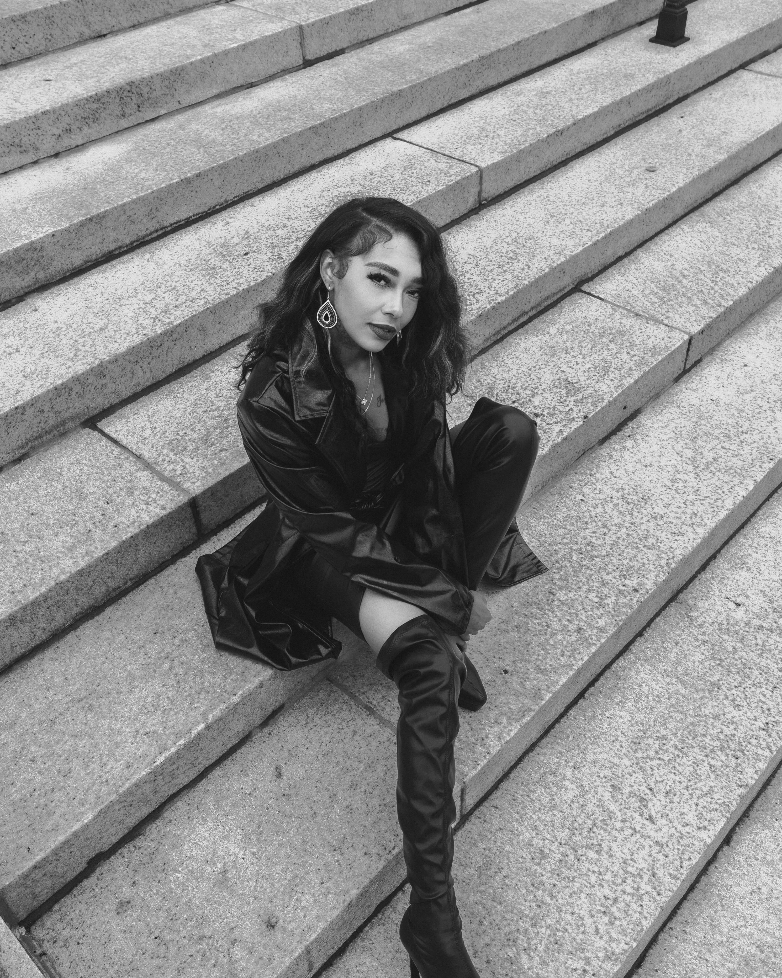 Downtown fashion portrait featuring long highlighted hair